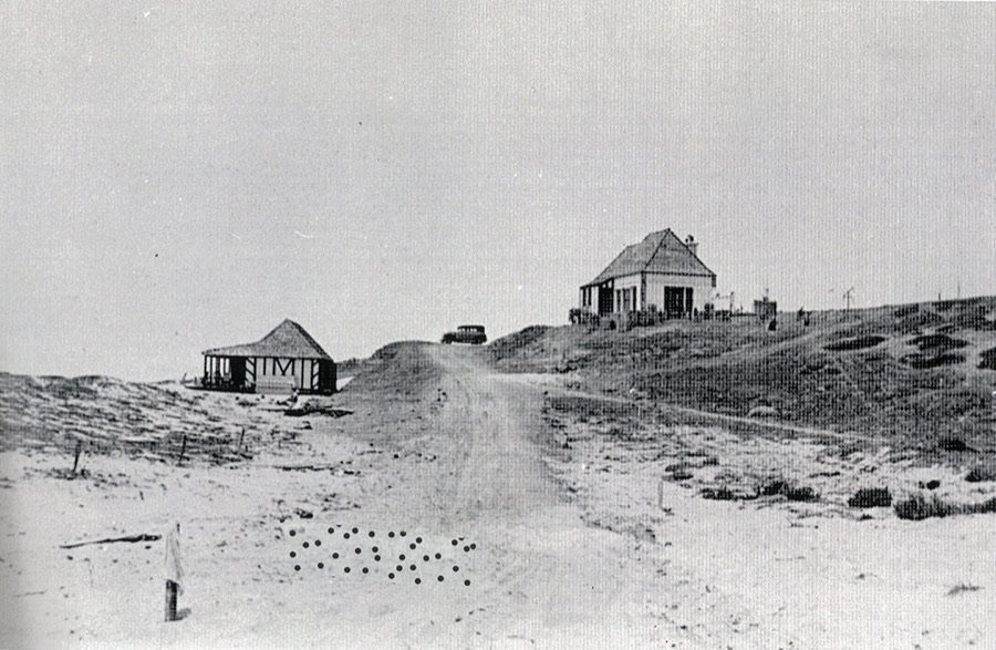 The first cottage and beach shelter standing alone on open sand