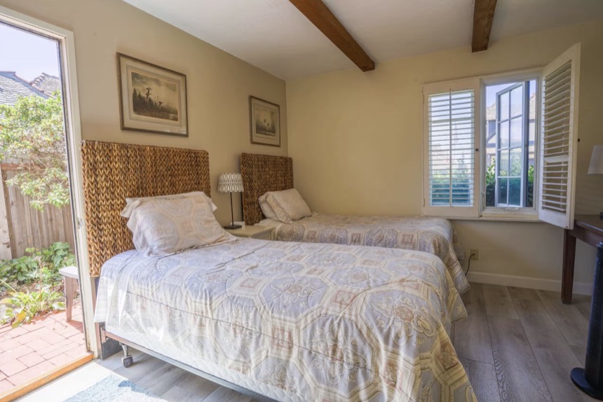 The downstairs twin room, two twin beds in morning sun